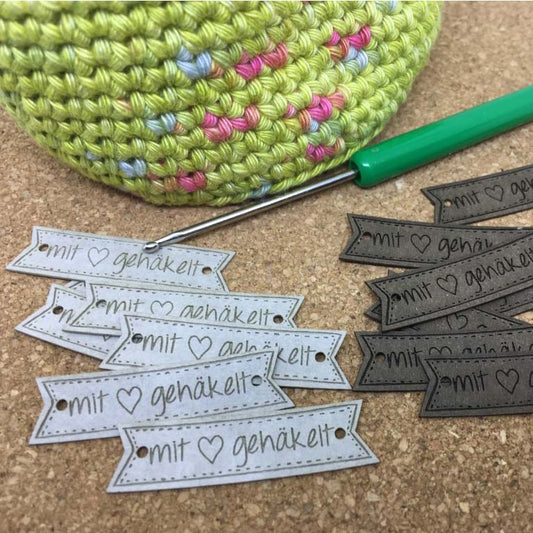 Label flag "crocheted with 🖤"